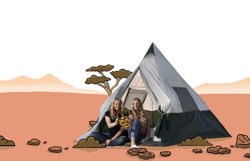 girls in a tent and looking at a Liahona