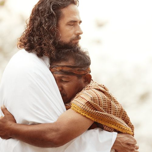 Jesus Christ embracing a man