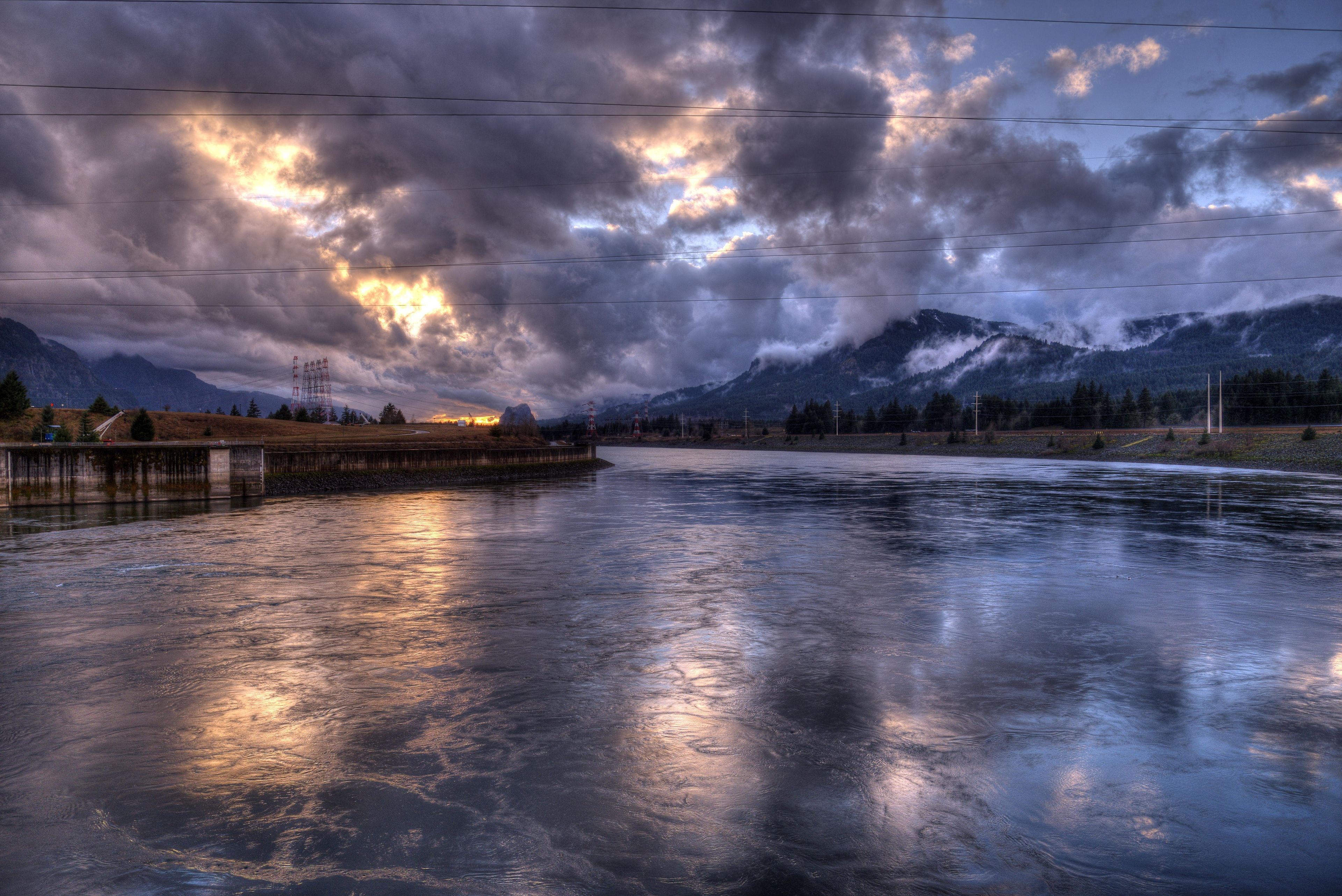 The sun sets over the frozen Columbia River in the winter.
