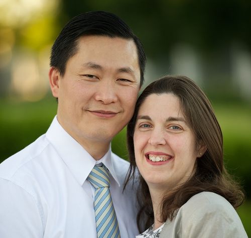 husband and wife posing for portrait