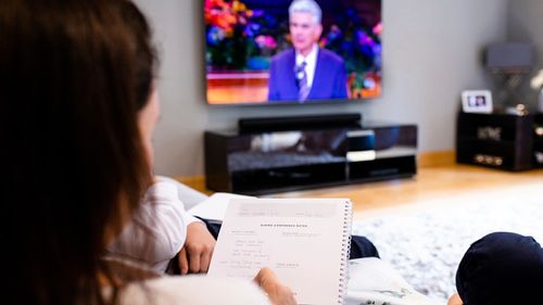 young person watching General Conference