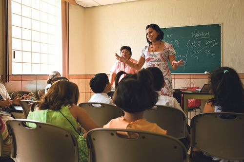 woman and children in class