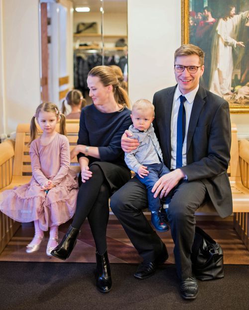 family sitting together at Church building