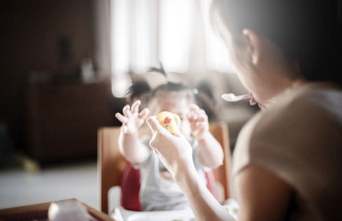 mother feeding a child