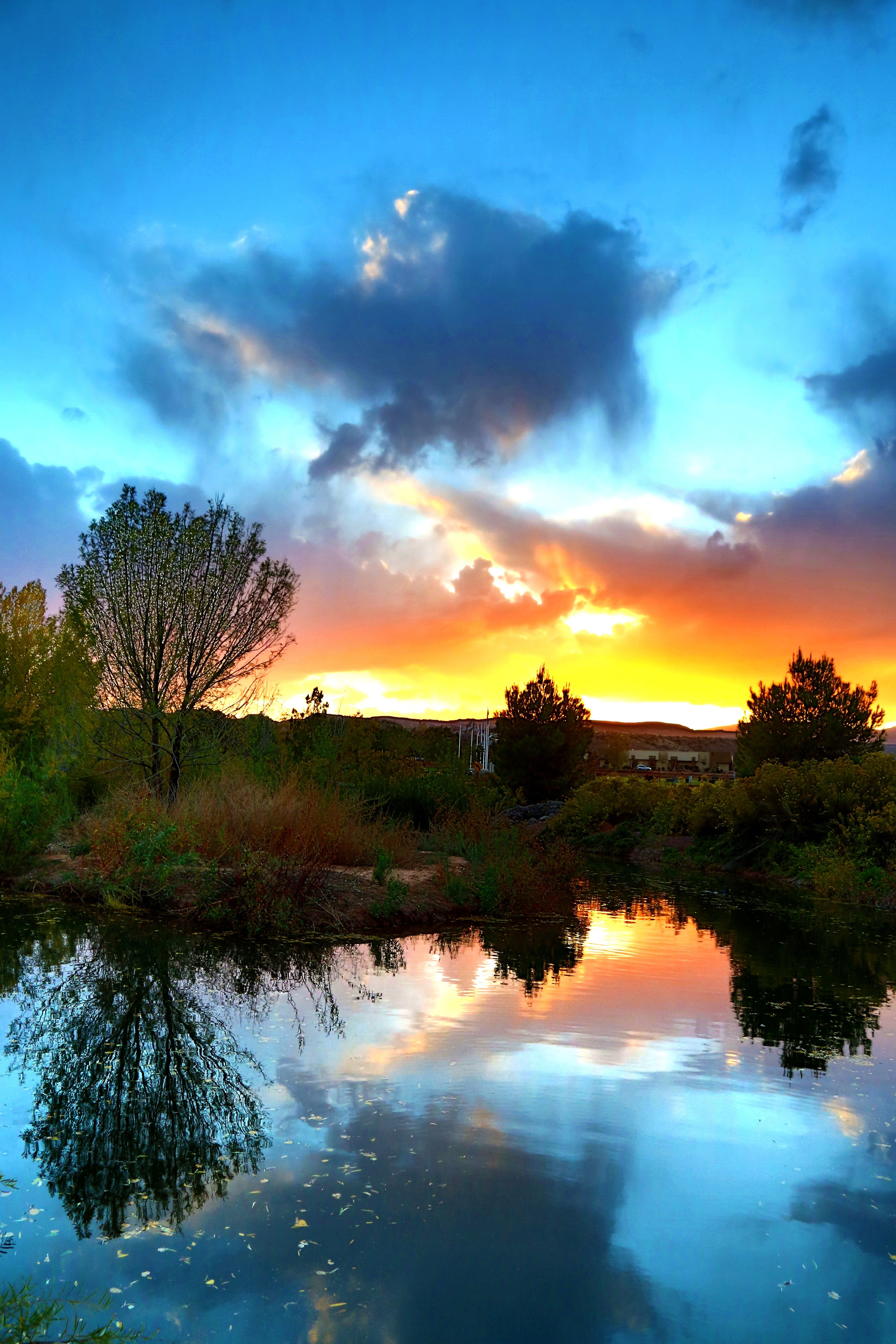 A sun sets over a lake in St. George, Utah.