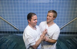 man getting baptized