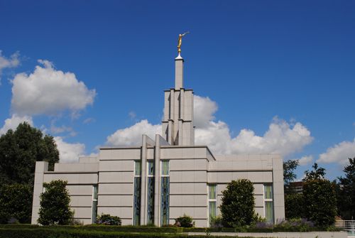 The back of The Hague Netherlands Temple, with surrounding grounds.