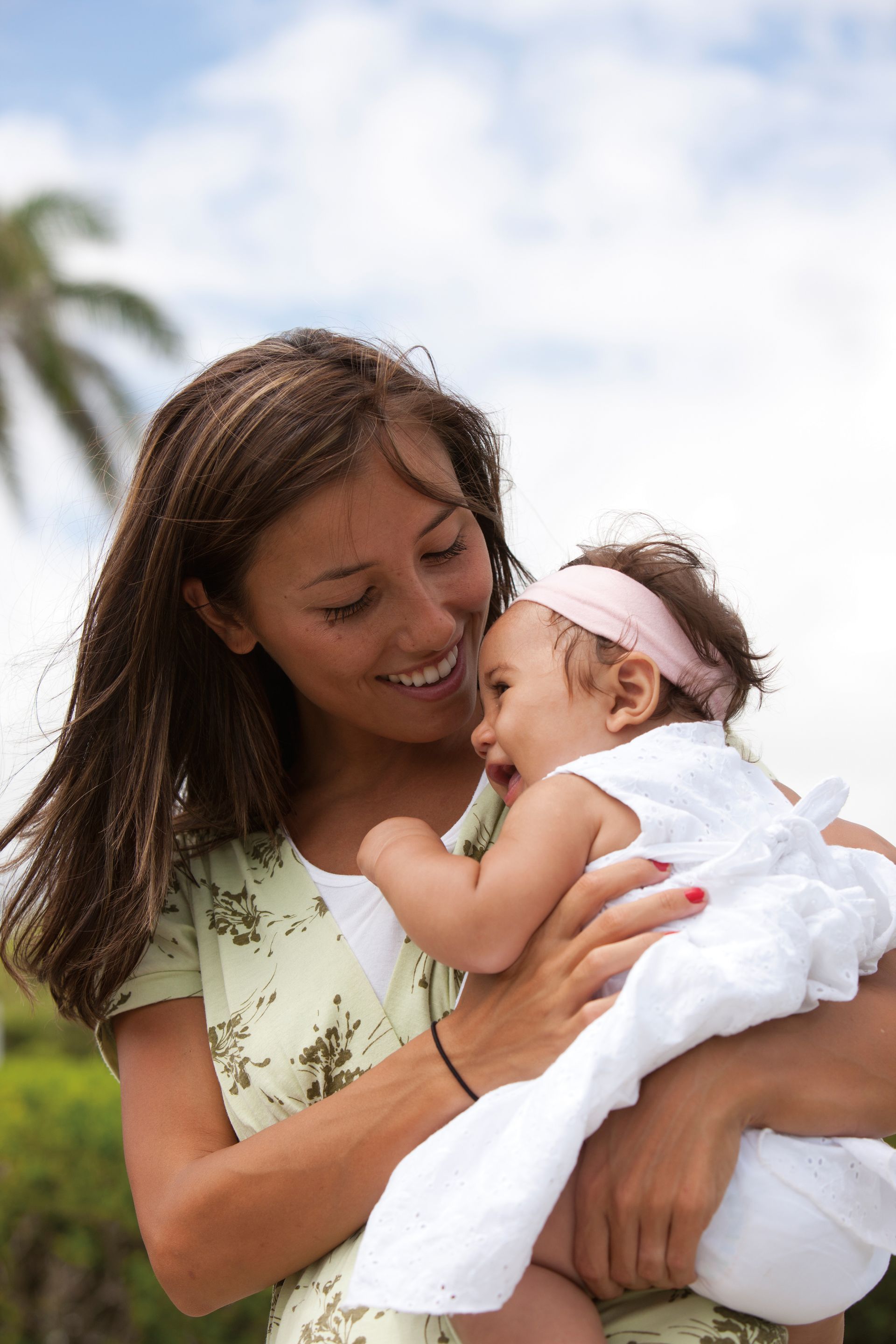 A mother in Hawaii holds her baby girl.