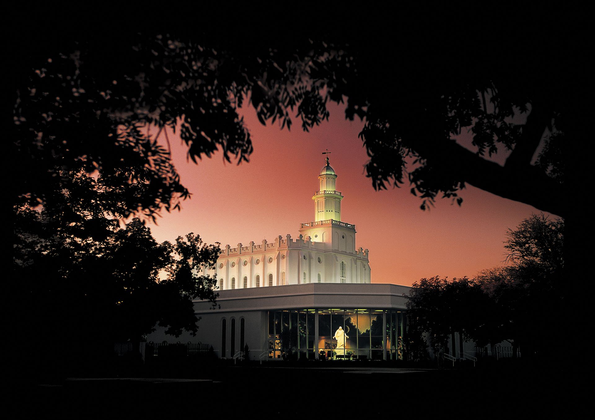 The St. George Utah Temple in the evening, including the entrance and scenery.