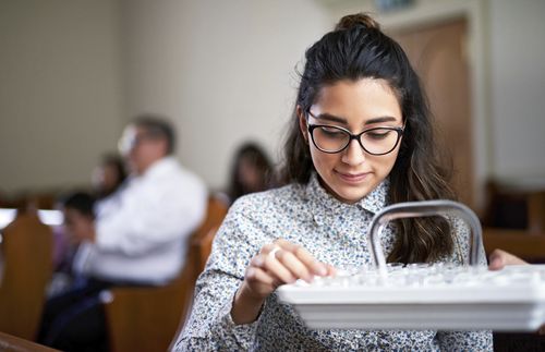 Young woman taking the sacrament