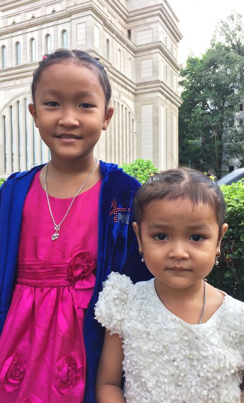 sisters in front of the temple