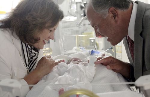 Elder and Sister Rasband with baby