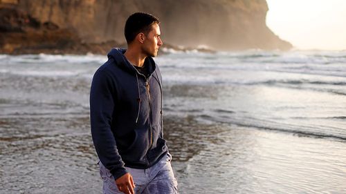 man walking on beach