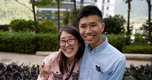 man and woman smiling