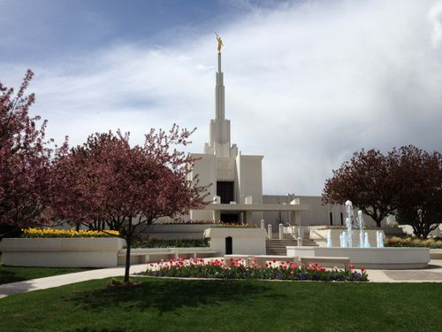 The Denver Colorado Temple and grounds on a spring day, with the trees in full bloom.
