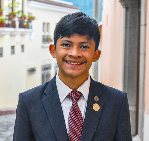 young man smiling in suit