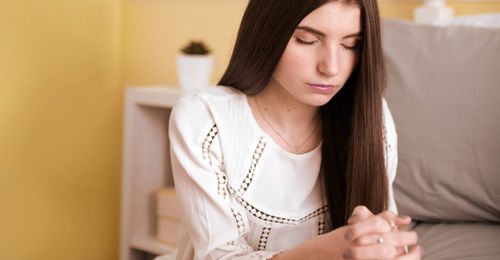 young woman praying