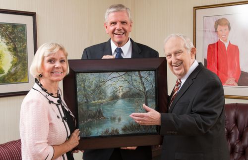 Arnolds and Elder Scott with painting