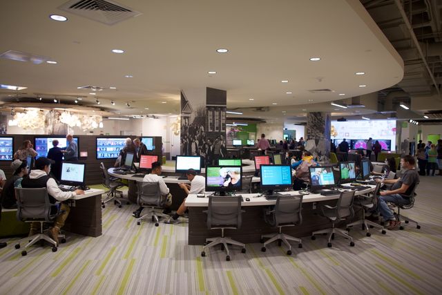 Family History Library Discovery Center located in Salt Lake City, Utah. People sitting at rows of computers.