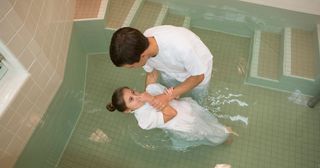 young girl being baptized