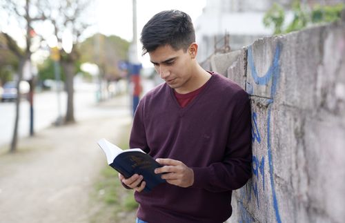 young man reading book