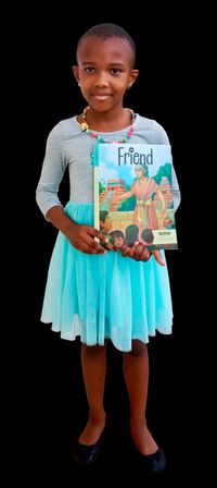 girl holding copy of the Friend magazine