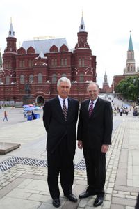 President Dieter F. Uchtdorf and Elder Neil L. Andersen stand together on a city square in Moscow, Russia.
