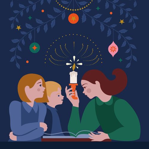 family with book and candle at Christmas