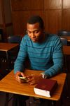 young man sitting in classroom