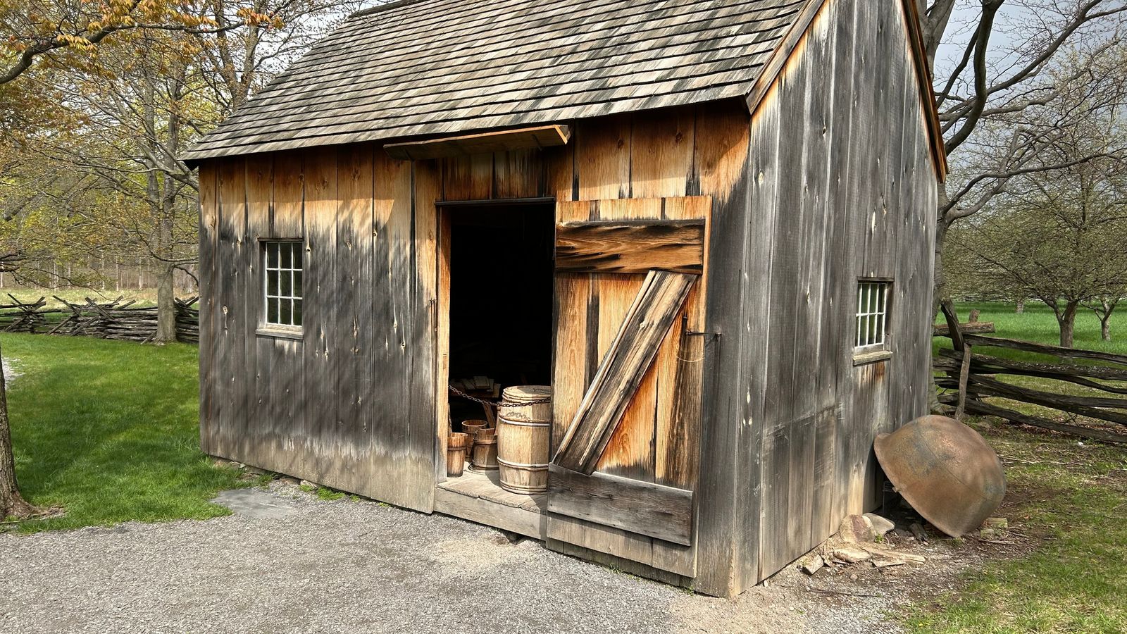 Exterior of a small wooden barn.