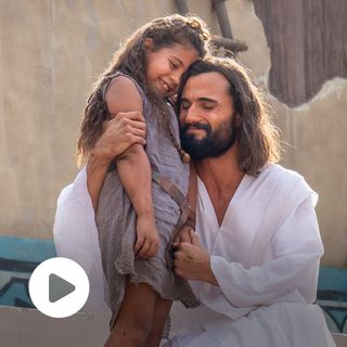 Jesus Christ greets Nephites on the steps of the Bountiful Temple. He embraces a young Nephite girl.