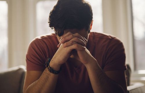 a young man praying