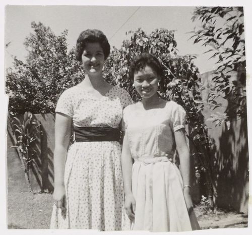 Dezzie Clegg and Nora Koot stand and smile at the camera.