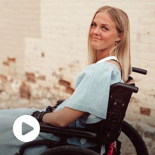 Photo of Emily Traveller outside in her wheelchair.